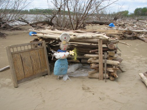 Mother Earth, child, driftwood structure, 4/09