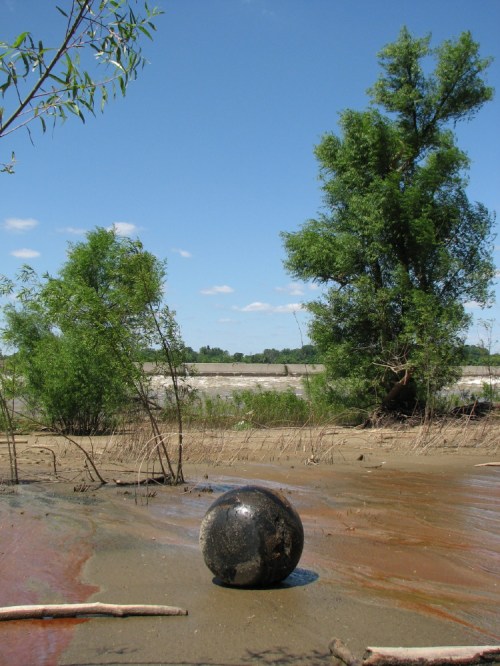 Black ball in riverscape