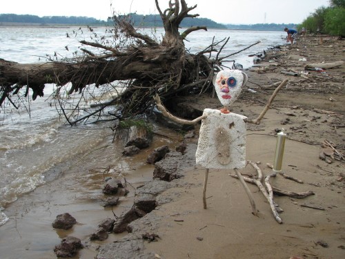 Starry-eyed figure by river, 8/09