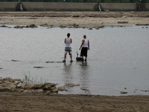 Two guys fishing in the middle of the river. 8/09