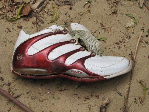 red and white athletic shoe
