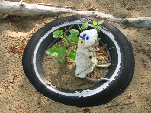 Kneeling figure in tire, 7/2010