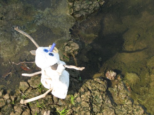 Exhorting kneeling figure, 7/2010