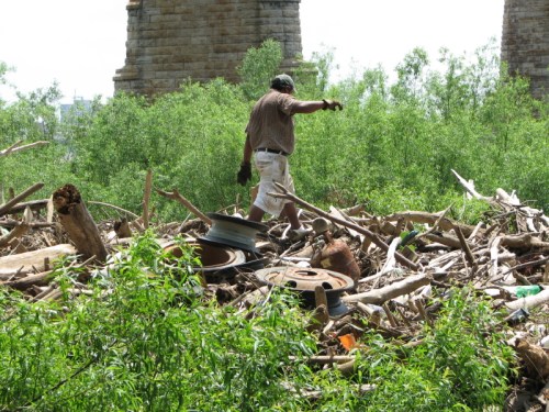 man salvaging tires, 2010