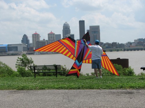 man with large kite, Louisville behind him, 2010