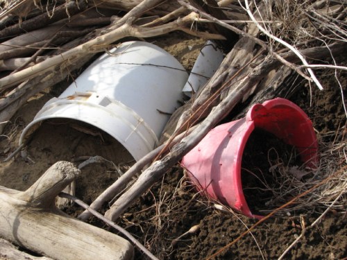 half buried plastic bucket and pail, 2/2011