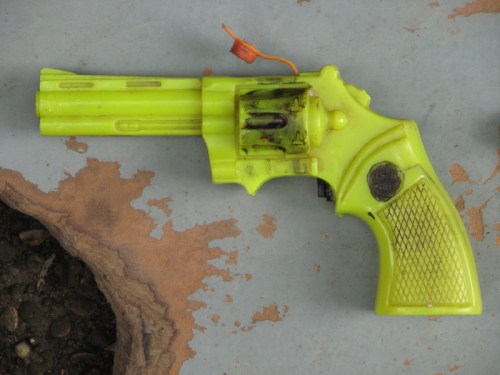 yellow plastic revolver squirt gun