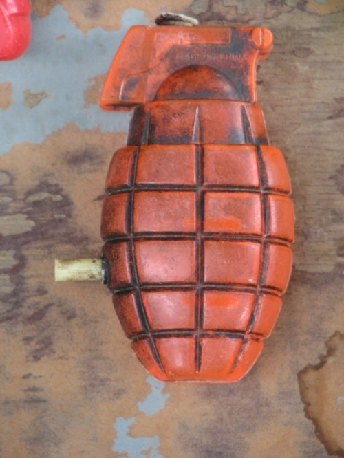 clear orange plastic hand grenade squirt gun