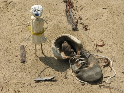 Little man with yellow belt and old shoe, 7/2011