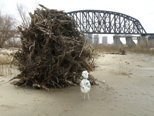 Styro-figure by large downed tree at the Falls of the Ohio, Jan. 2013