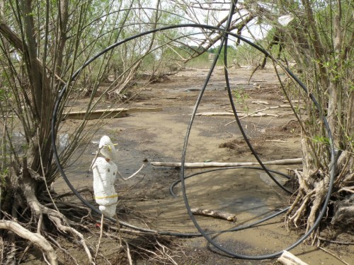 figure with plastic cable in the trees, May 2013