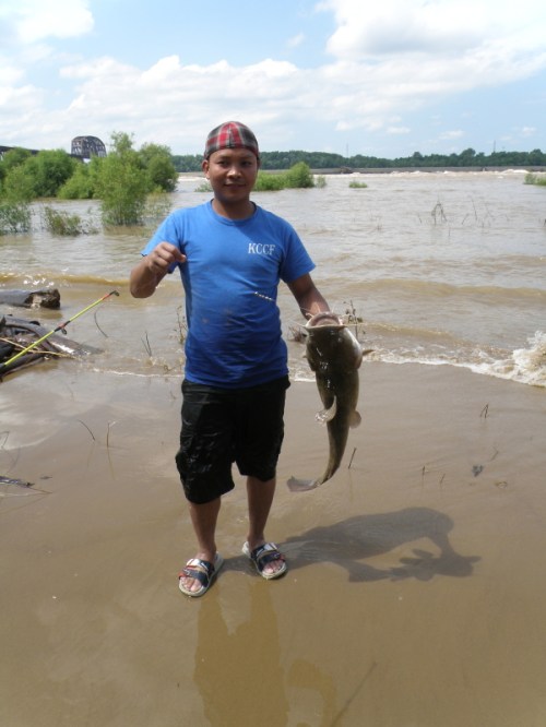 Man with Flathead Catfish, Falls of the Ohio, July 2013