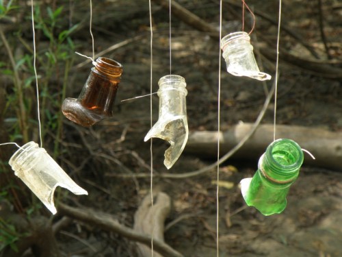 detail, various glass bottlenecks suspended by waste fishing line, 2013