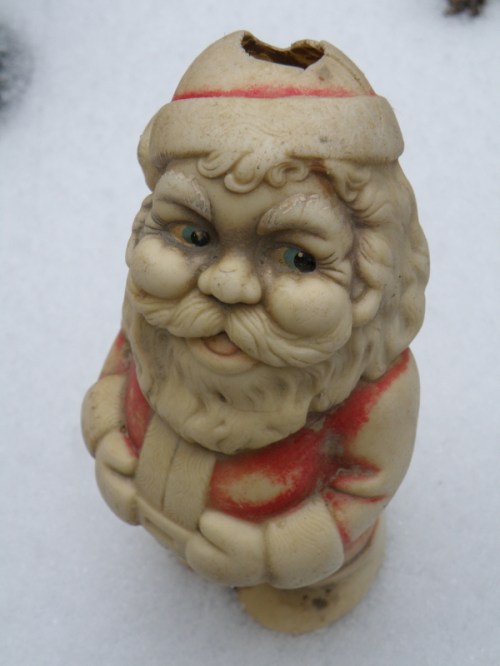 found plastic Santa Claus on snow, Dec. 2013