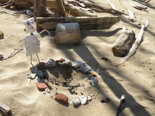 figure next to an old camp fire site, April 2014