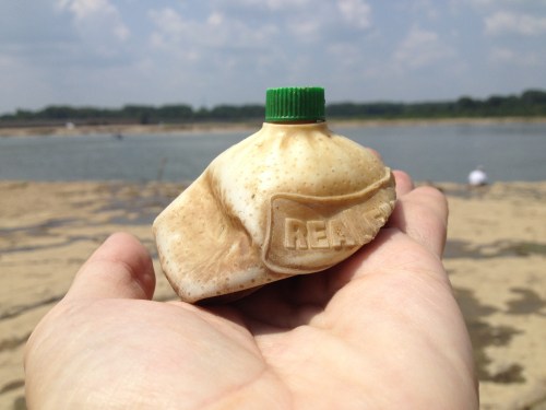 squished plastic "Real" lemon juice container, Aug. 2014