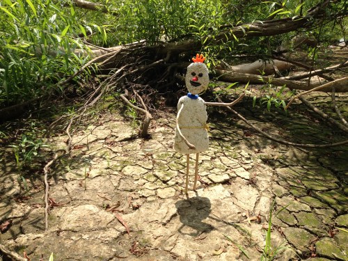 artist with orange hand on his head, Falls of the Ohio, Aug. 2014