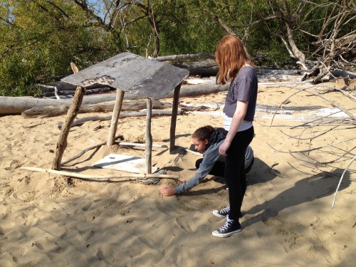Girls making a driftwood shelter, Falls of the Ohio, Oct. 2014