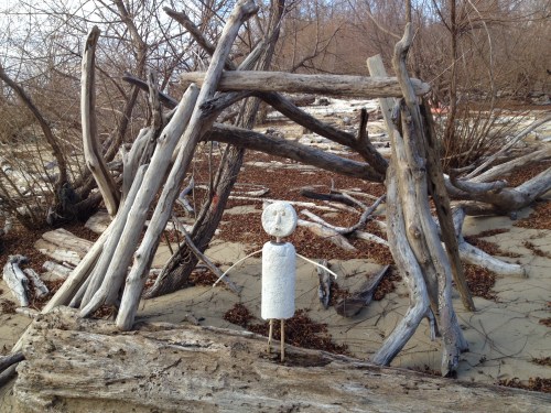 Styro-figure posed next to anonymous improvised driftwood shelter, Falls of the Ohio, Nov. 2014