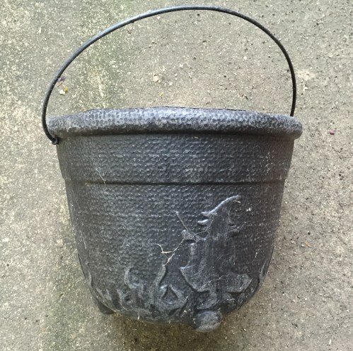 Black plastic witch's cauldron candy carrier, Falls of the Ohio, 2015